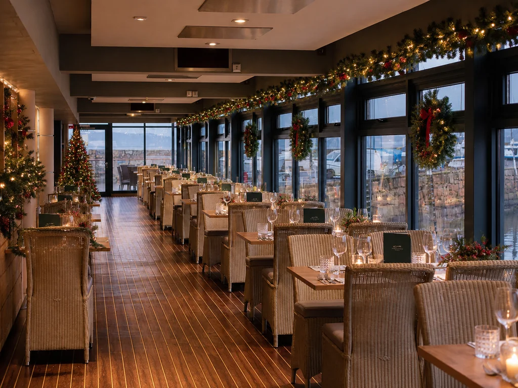 Festive table setting overlooking St Aubin harbour